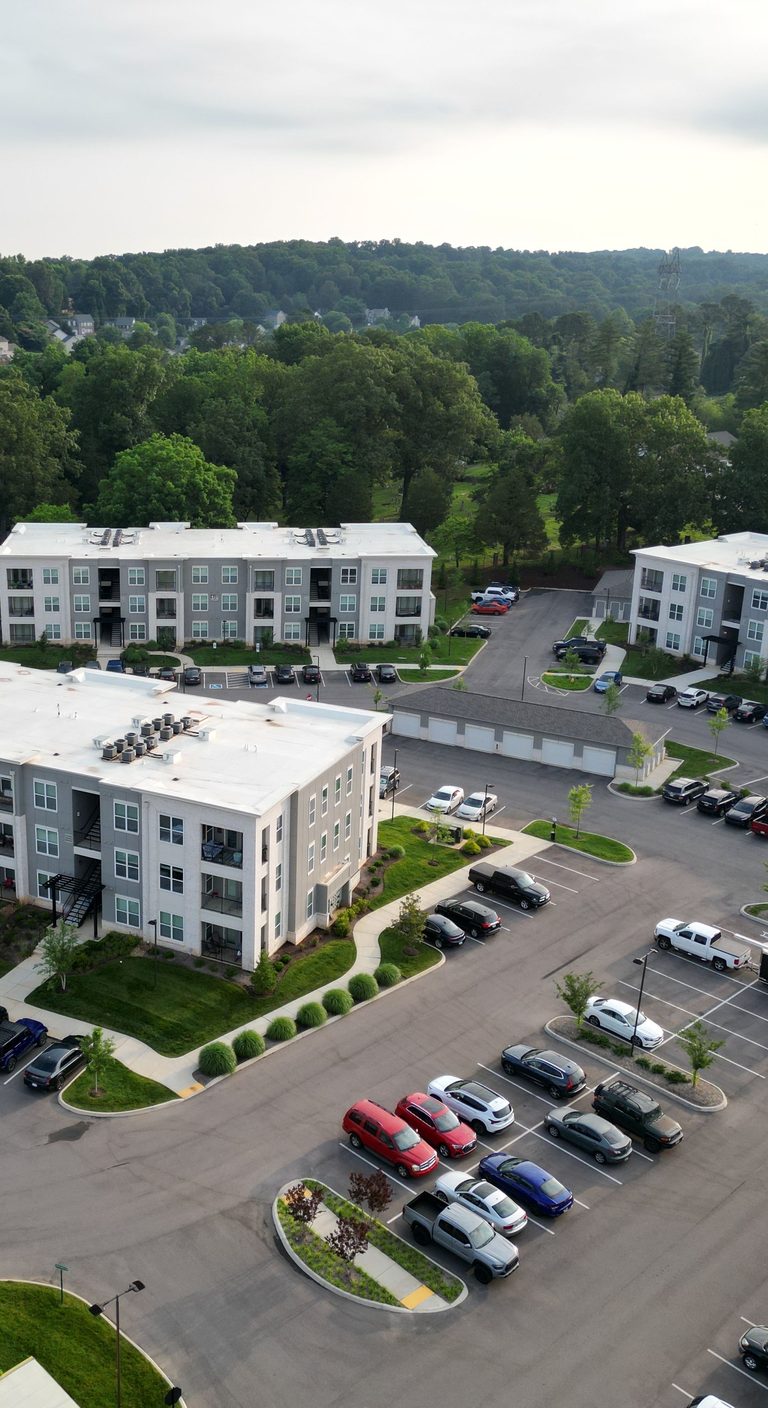 Apartment buildings with their own surface parking lot, seen from above
